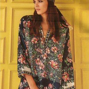 This Kish Tunic flows gently over the body. Delicately delicious doused w floral